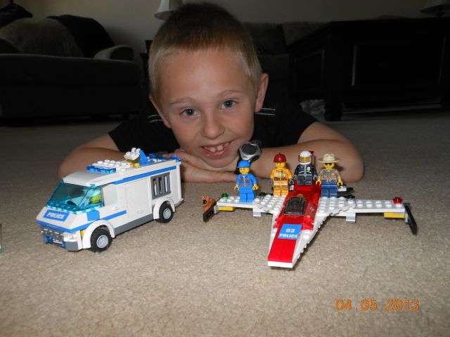 child playing with lego.