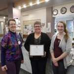 Agnes Rivers-Moore, Board Chair Pamela Matheson, and computer trainer Cara Benninger with Angus Mowat Award certificate